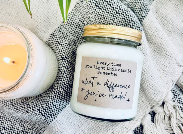 Personalised candle with inscription 'Every time you light this candle remember what difference you've made!'